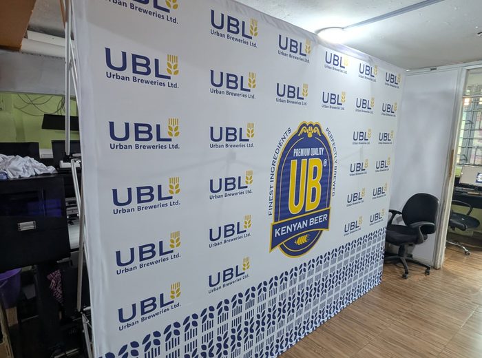 Branded step-and-repeat media wall printed by Ocean Graphics