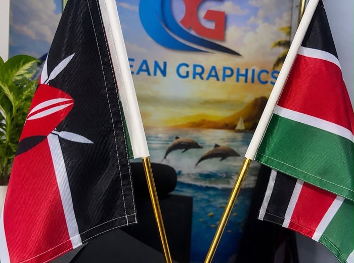 Desk flags and shop backdrop printed by Ocean Graphics